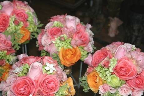 Rich mix of garden roses and lisianthus in pinks & peach with mellow green