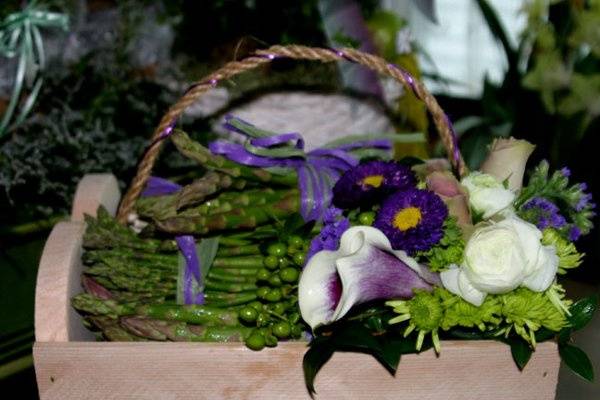 Unique Centerpieces of Organic Veggies and flowers, each table was a different focal veggie! This one Beets