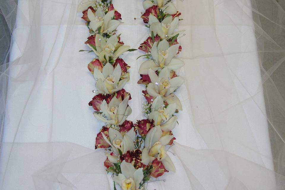cymbidium orchids and roses made for bride and groom for their wedding ceremony use