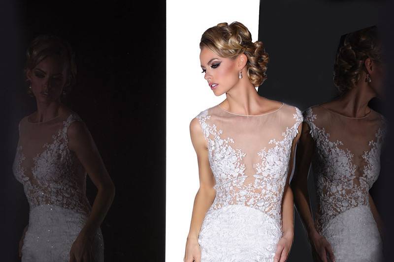 90201	<br>	THIS ROMANTIC FIT AND FLARE GOWN DECORATES WITH DELICATE LACE REVEALING A HINT OF SKIN, FINISHED WITH AN ILLUSION BATEAU NECKLINE AND KEY HOLE BACK