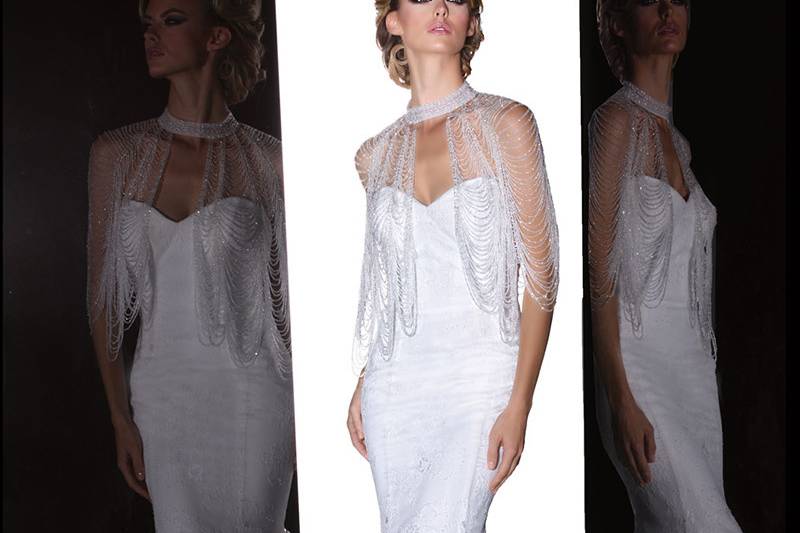 90203	<br>	THIS VINTAGE CHIC LACE GOWN FEATURES A DAZZLING BEADED BOLERO