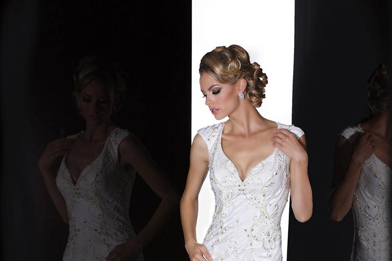 90207	<br>	THIS INTRICATE LACE GOWN WITH CRYSTALS DELICATELY SPRINKLED THROUGHOUT AND FEATURES A MODIFIED SWEETHEART NECKLINE AND KEYHOLE BACK