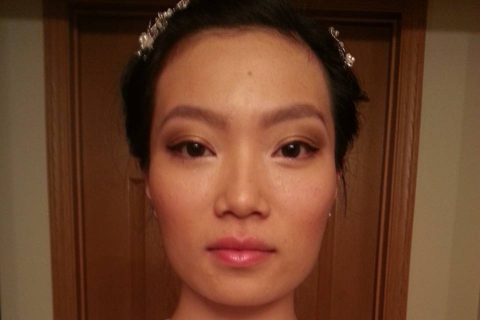 Basic Foundation Bridal Application. Client requested golds and browns and pulled further up to dramatize look in pictures. We also did brow shaping which included tweezing and filling.