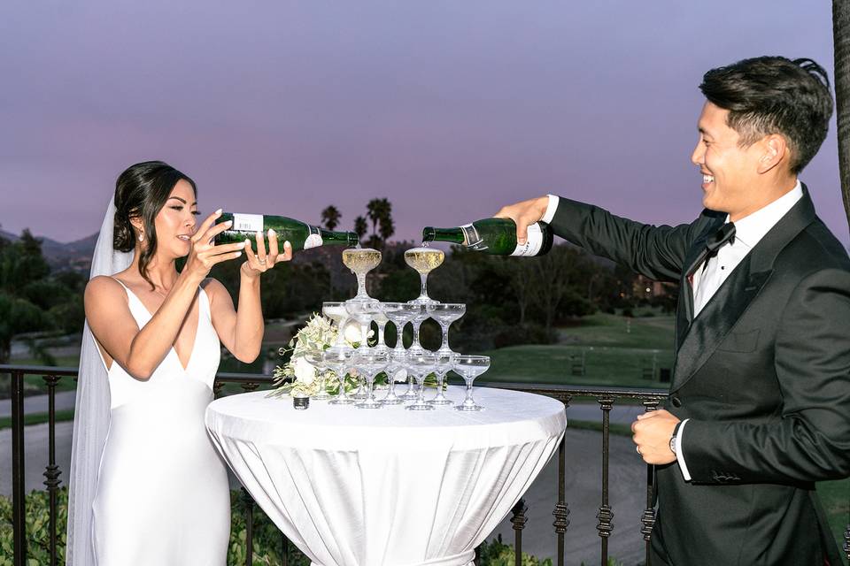 Couple doing a champagne pour