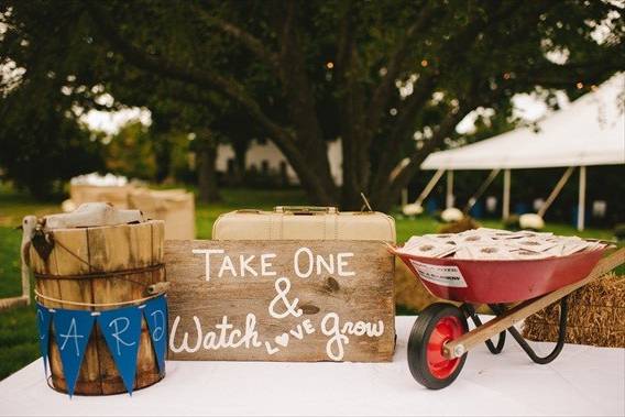 A wheel barrow full of our Personalized or Custom printed Wildflower Seeds to delight your guests!