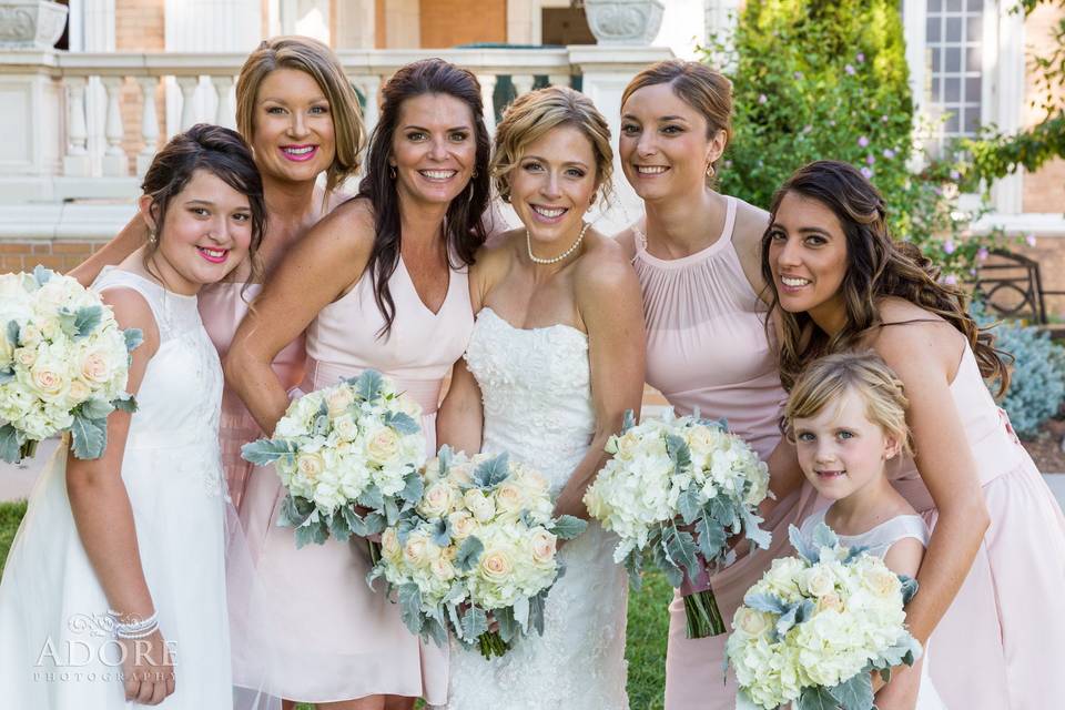 The bride with her bridesmaids and flower girl