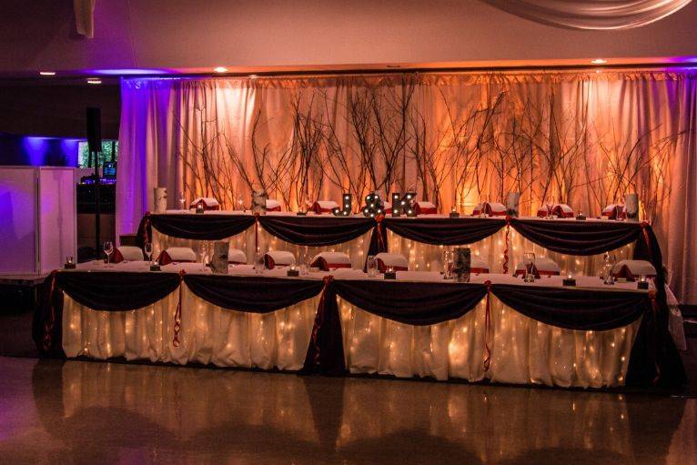 Couple and bridesmaid and groomsmen table area