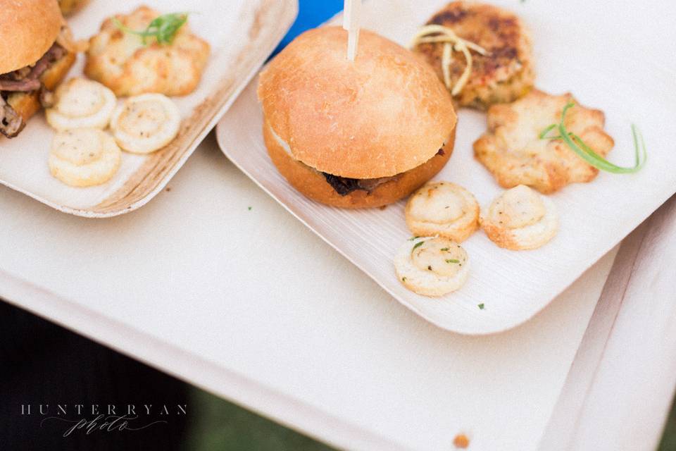 Bride and groom sampling plates during photos