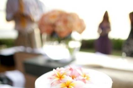 Two tier wedding cake with kalachuchi flowers