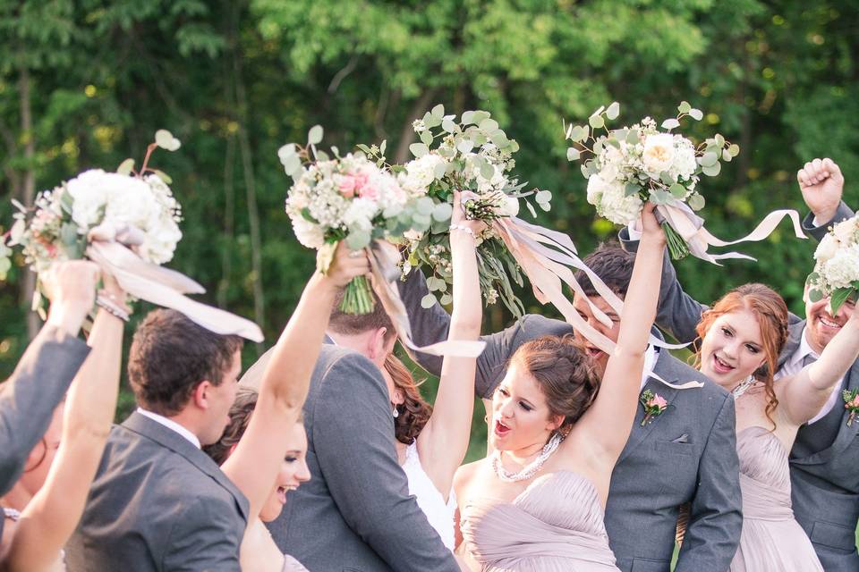 The couple together with their bridesmaids and groomsmen