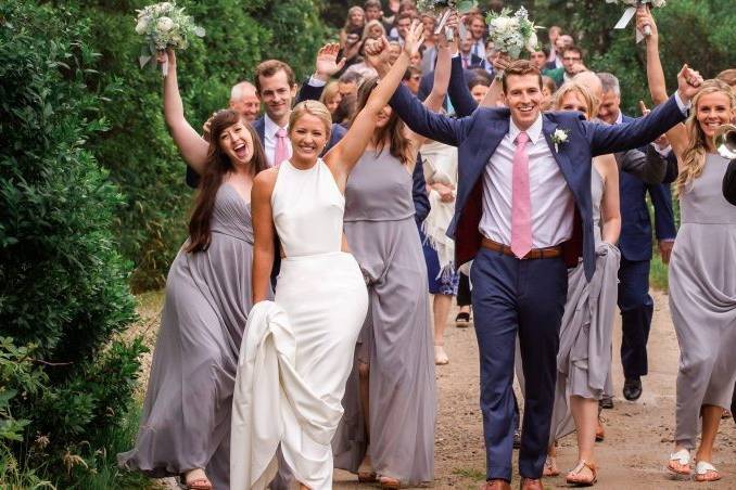 Wedding party and guests celebrating