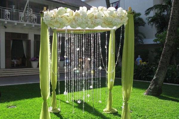 Bamboo arbor with crystals, kiwi fabric, anthuirums & hydrangeas