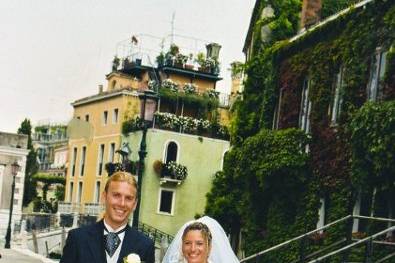Walking the non auto streets of Venice, Italy after their wedding celebration.
