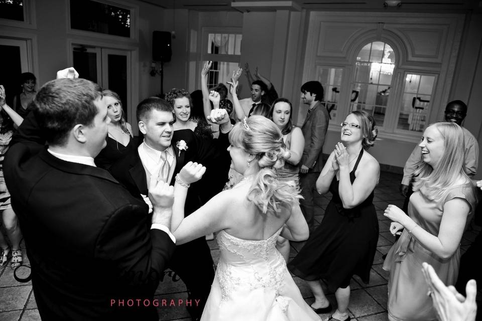 Newlyweds dancing with their guests