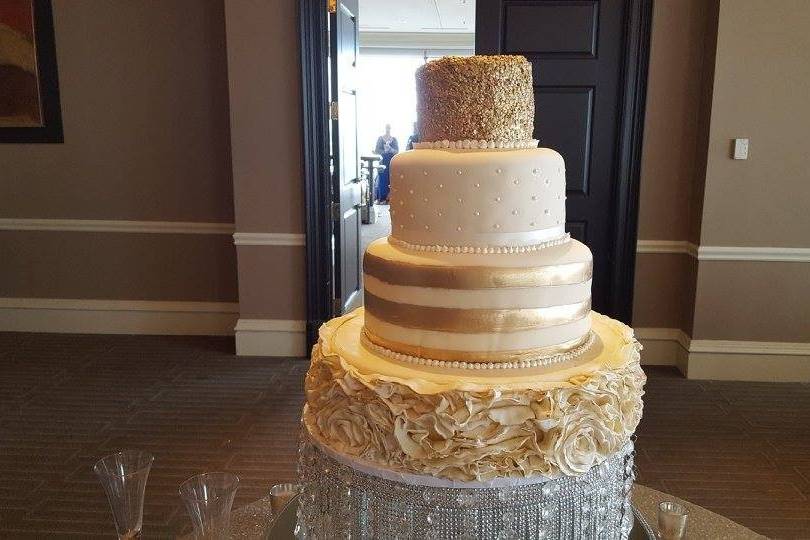 Gold and white wedding cake