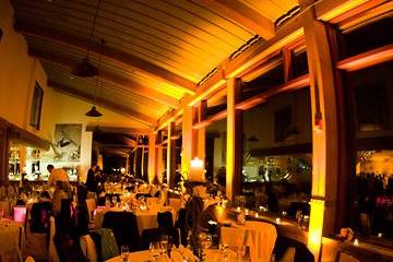 Warm amber lighting on beams in a mountain top lodge