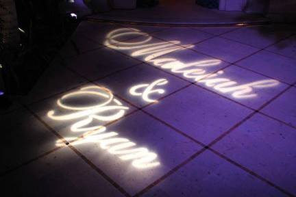 Custom gobo of bride and groom's names at a wedding in Cabo