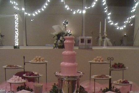 White chocolate colored pink to coordinate with pink and white wedding colors.
