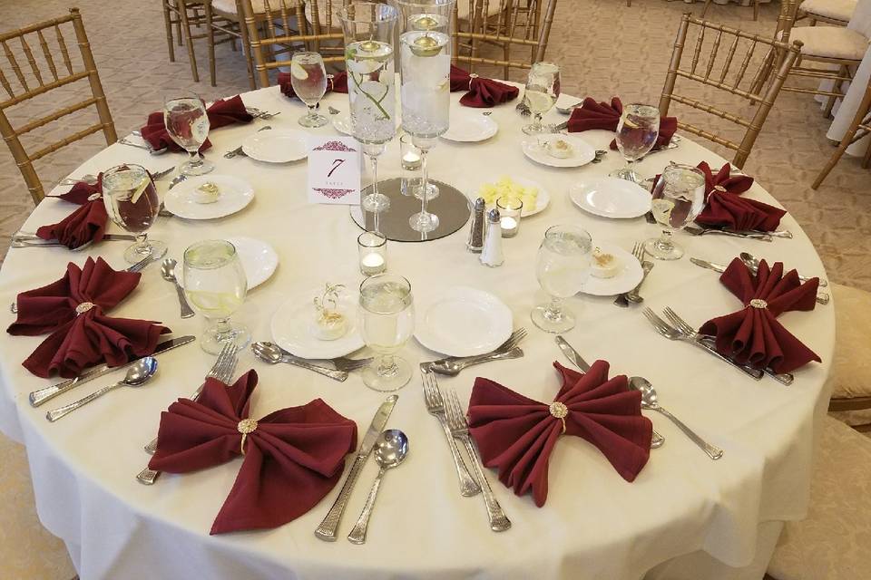 Table scape, centerpiece & napkins with custom napkin rings.