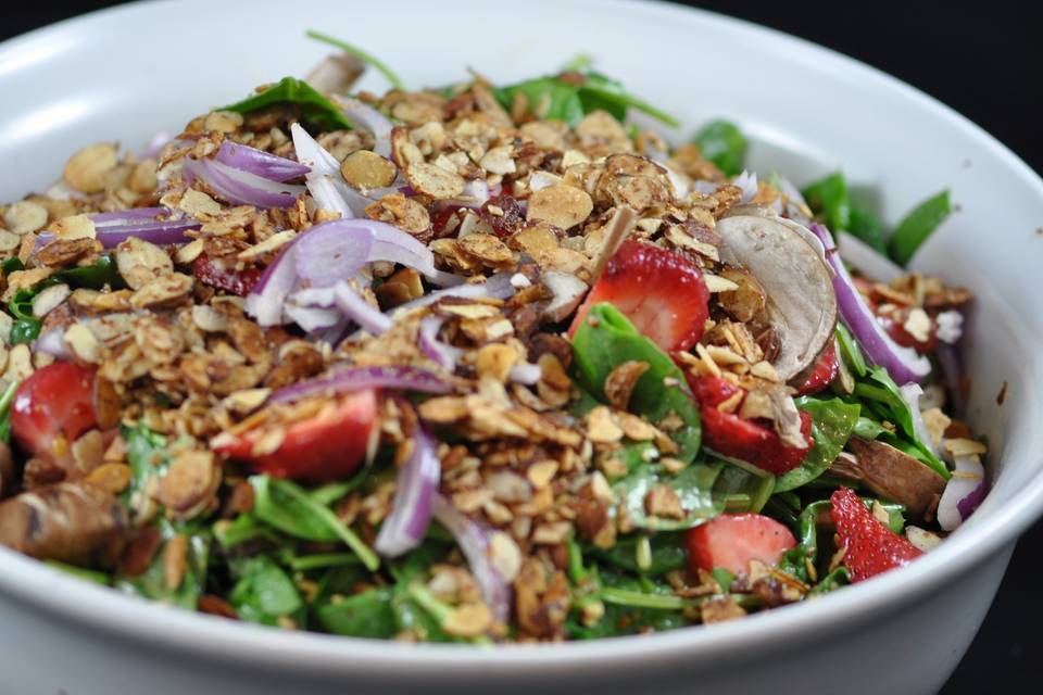 Spinach salad with strawberries, red onion, mushrooms, candied almonds and cider vinaigrette