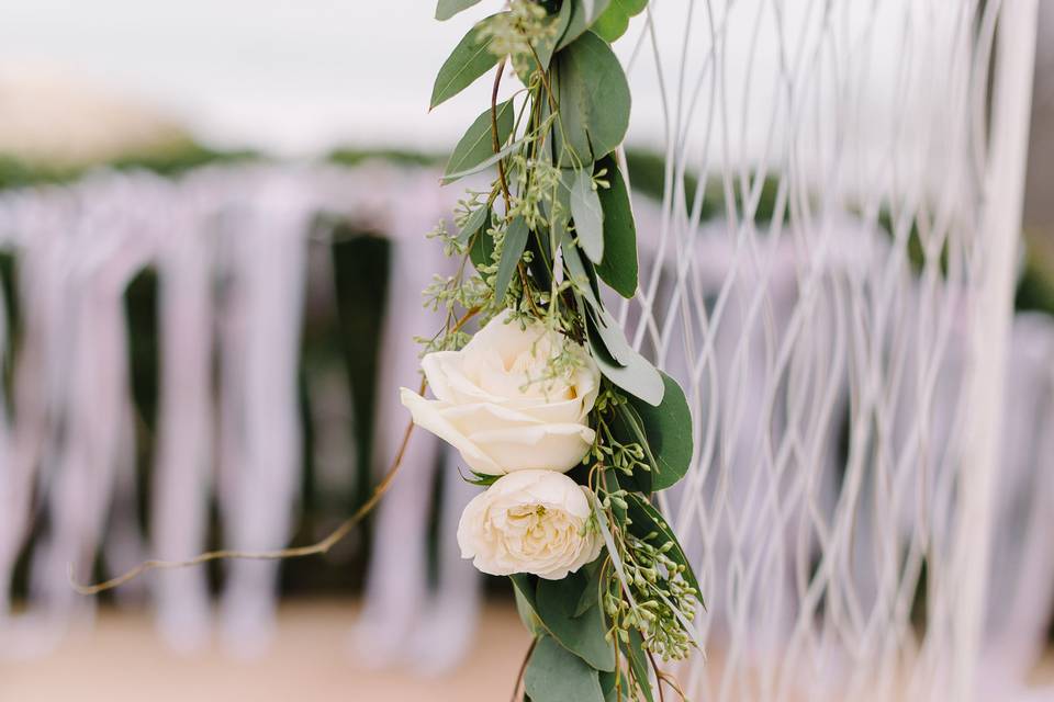 Close up of the shabby chic arch and rose garland.