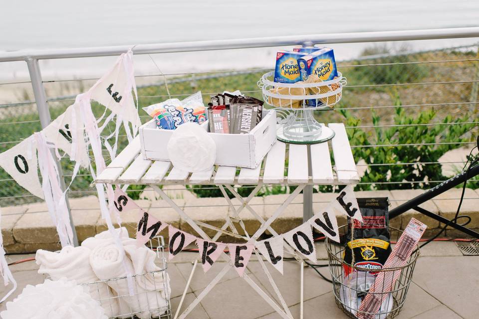 A s'mores station was set up by the fire pits for the Reception