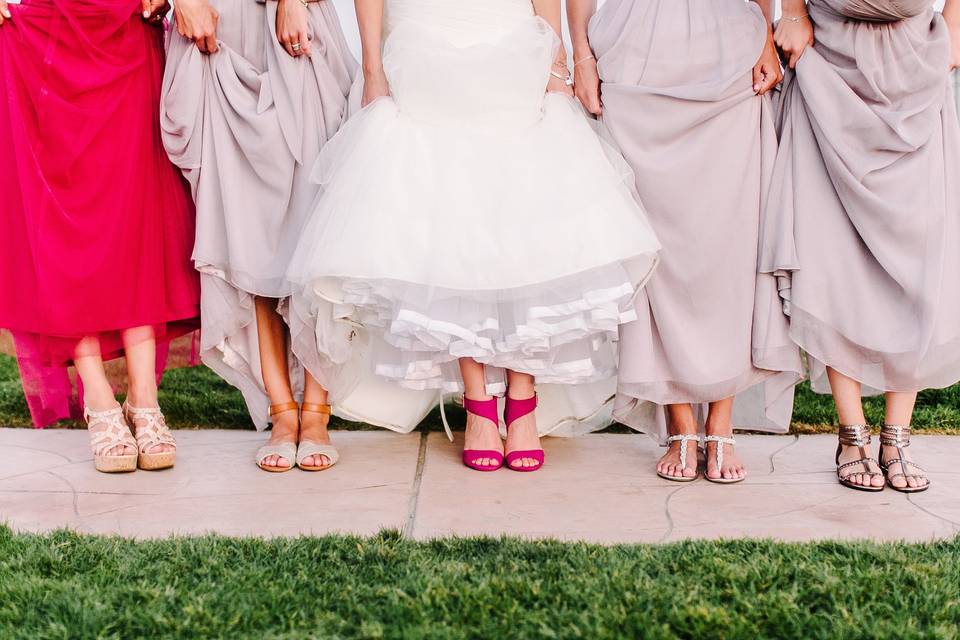 The tables were decorated with white candles, roses in varying size vases, mason jars for water goblets and striped  paper straws.