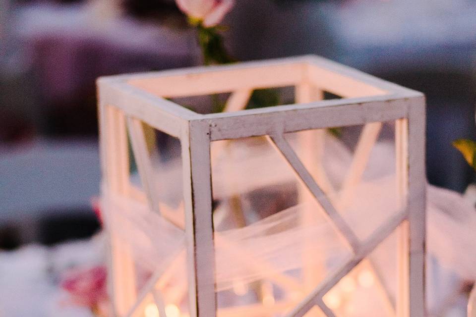 The glowing centerpieces nestled among the roses and ruffles made an incredibly romantic tablescape.