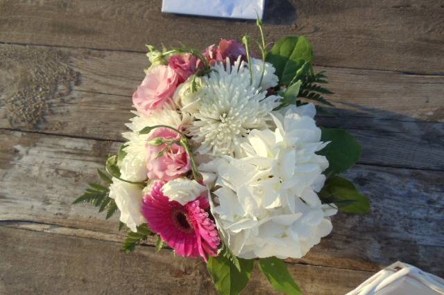 Table assignments were displayed simply in a vase with ribbon and wood enhanced signage.