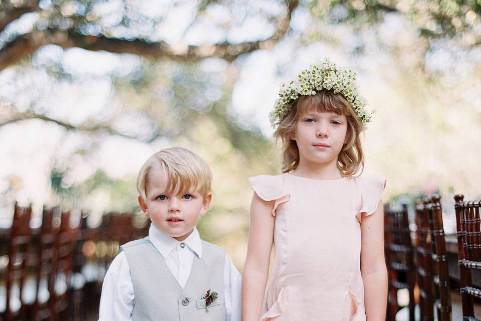 the flower girl had a beautiful daisy crown and both ring bearer and flower girl were adorable in nuetral tones.