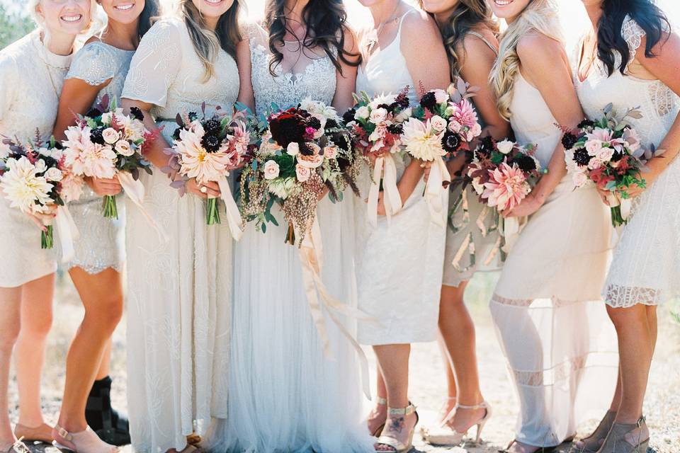 Amazing floral by Adornments. Bridesmaid were in differing, neutral dresses. Boho Chic.