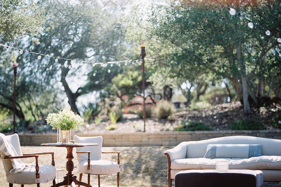 We constructed a 70s inspired lounge area near the stage for guests to enjoy the concert during cocktail hour and the Reception by The McCoy Tyler Band. Vintage Rentals through Embellish at Tiber Canyon Ranch. Photos courtesy of Jamie and Chase Photography.