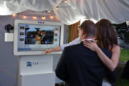 Bride and Grooms love the TapSnap unit.  Add digital props, change the backgrounds, print and sent to social media all at the kiosk!