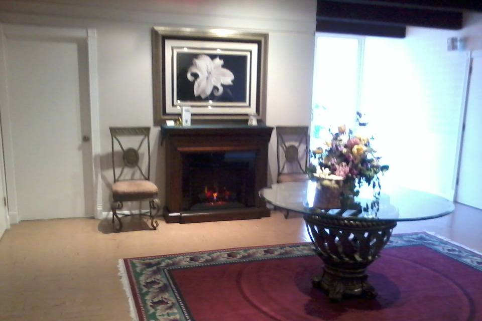 Fireside ambiance in entry way.