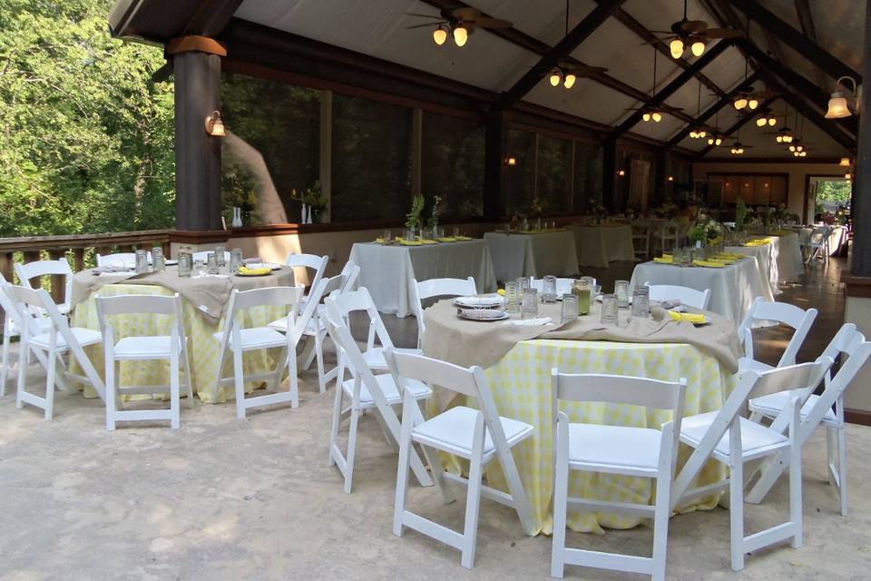 guest seating under the pavilionthese were yellow and white gingham with burlap overlays