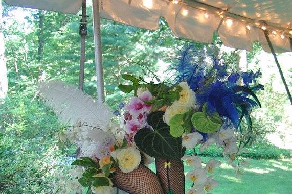 Stunning show girl legs brimming with cabbage roses, phalenopsis orchids, ostrich feathers and more at a private celebration this fourth of july