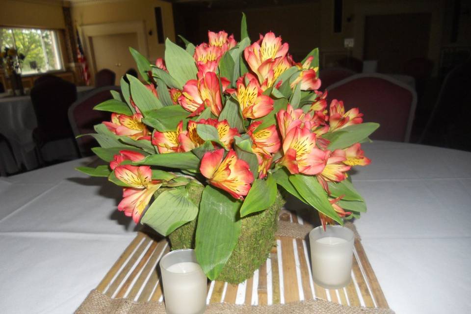 This arrangement of alstromerias in a moss basket was simple and lovely,