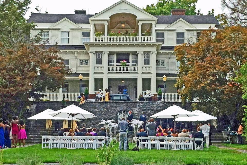 View from the reflecting pool at the wedding of Marcus and Nicola held at the Mansion at Noble Lane in Bethany, PA.