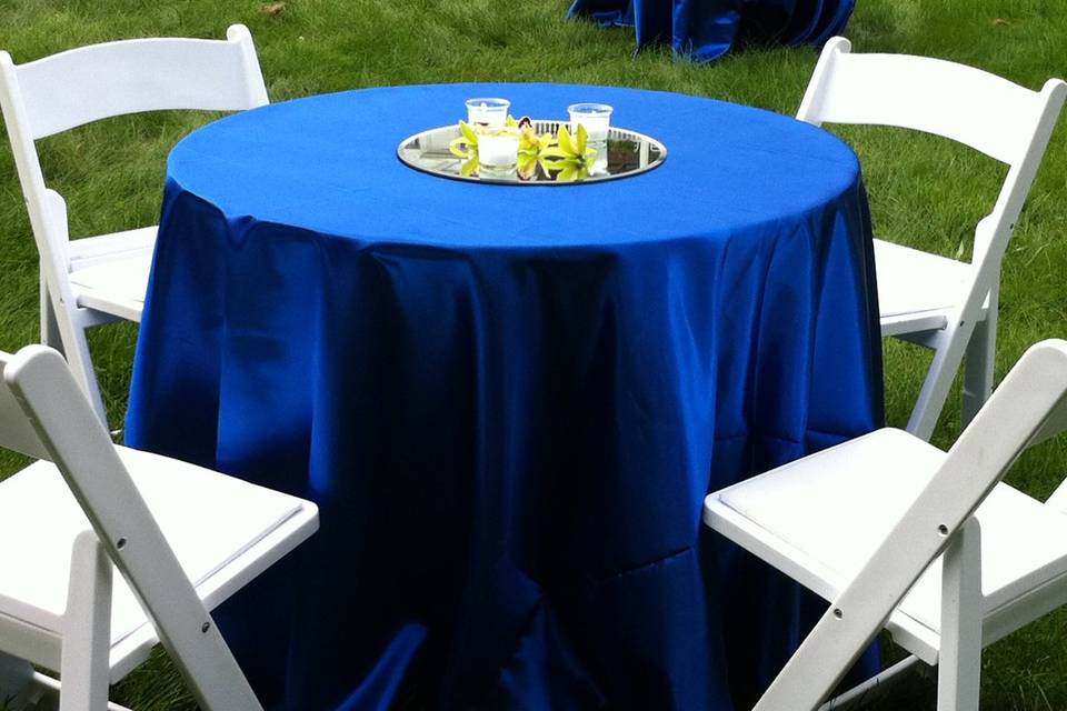 Cocktails were served on the middle lawn by the reflecting pool at The Mansion at Noble Lane in Bethany, PA.  Cymbidium orchids and votives graced the tables.