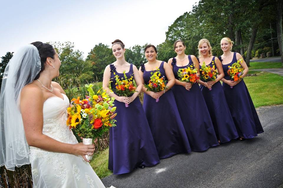 The bridesmaids in royal purple wore the perfect contrast for  their colorful bouquets!
Carol Mc Donald Photography of Scranton