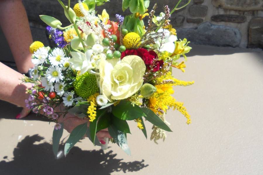The bridesmaids' bouquets incorporated a mix of the flowers used in the centerpieces.