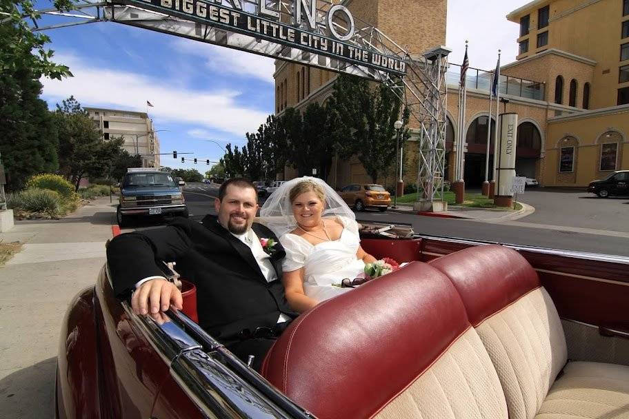 Bride and groom in their wedding car