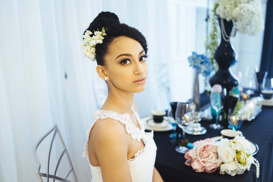 Wedding updo with flower accessory