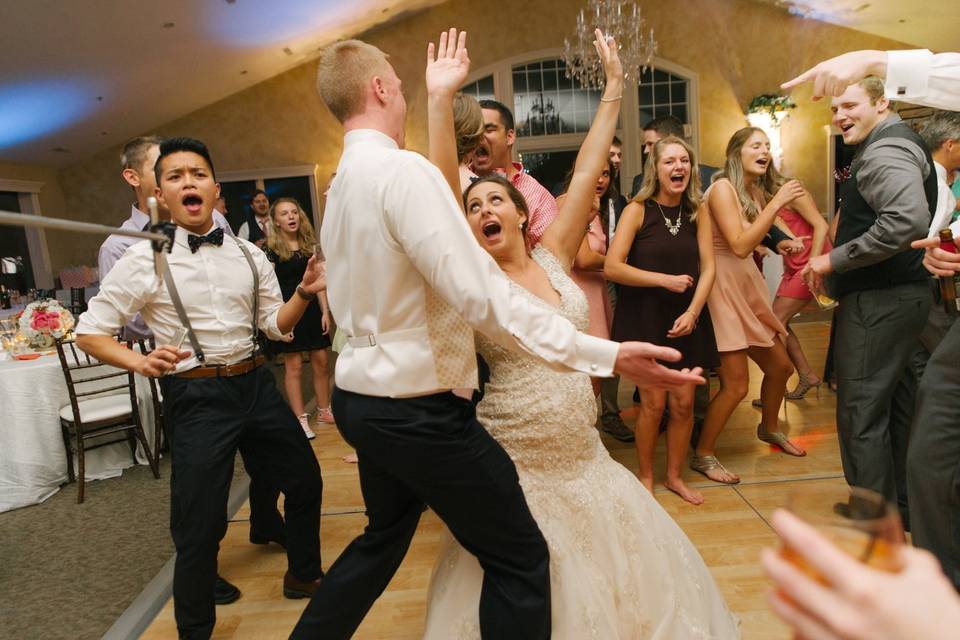 Couple and guests dancing