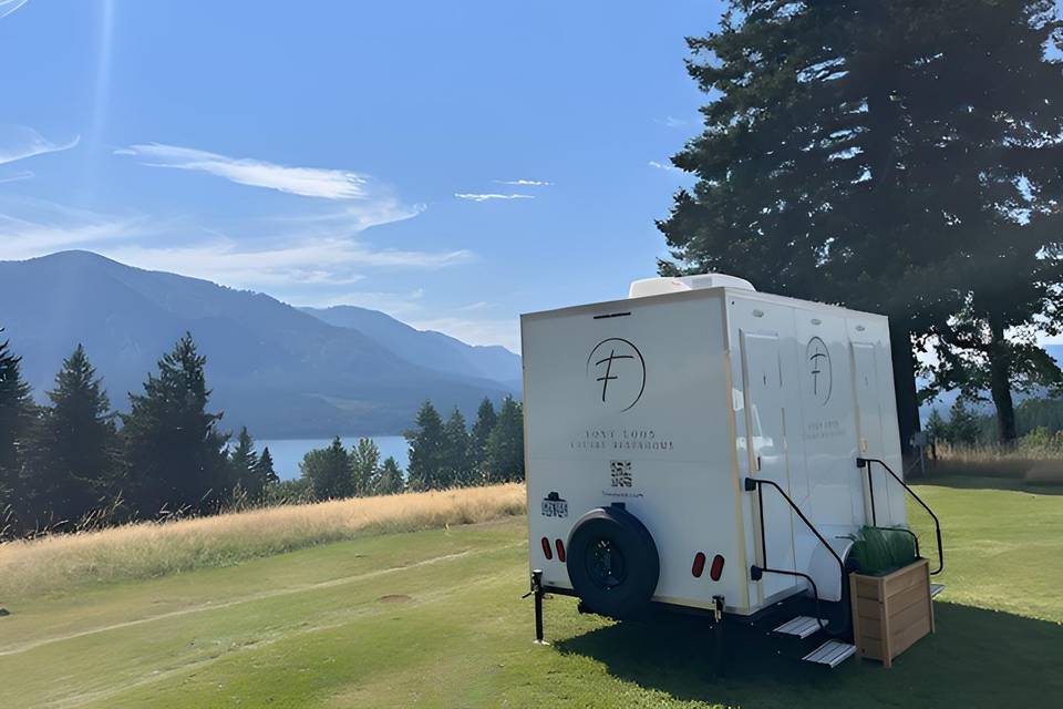 Restroom trailer near river