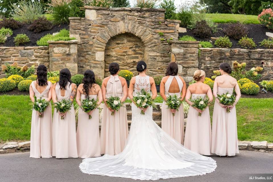 Bride and her bridesmaids with their bouquets