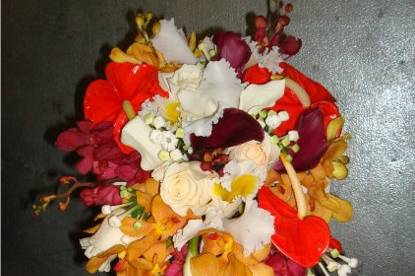 Casket bouquet the colors is burgundy, orange, red, and ivory
