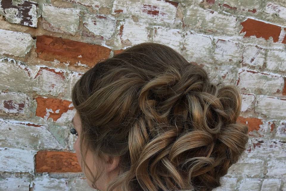 Curly hair tied into an updo