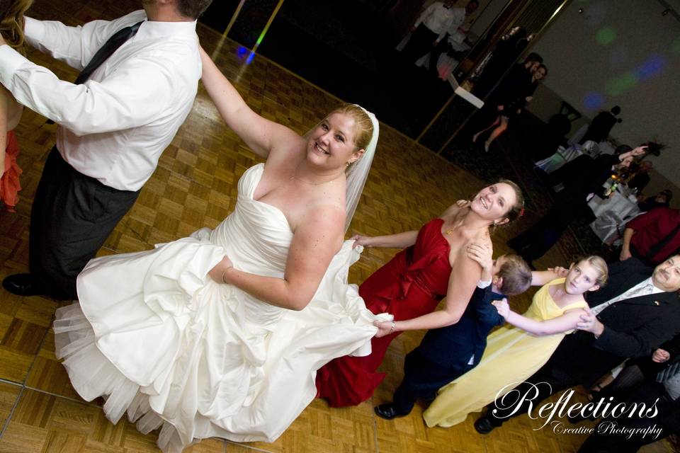 Guests abd the v=bride dancing