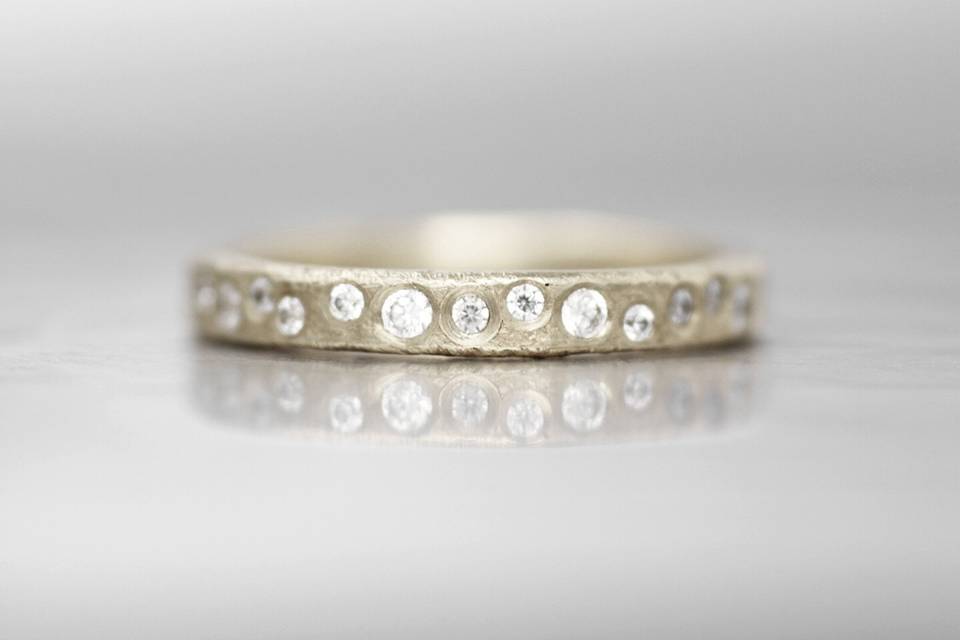 VERMILLIONThis timeless diamond wedding band brings an element of class and comfort. The signature Wanderlust texture creates a subtle and organic feel that will wear perfectly over time.